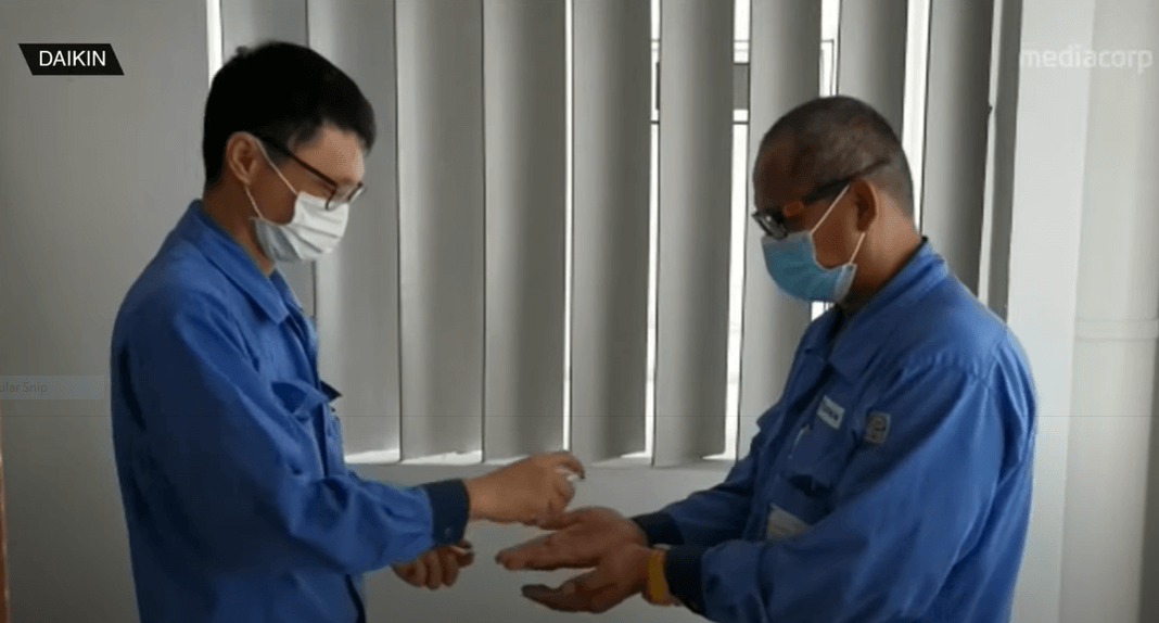 Daikin Service Staff Sanitising Hands